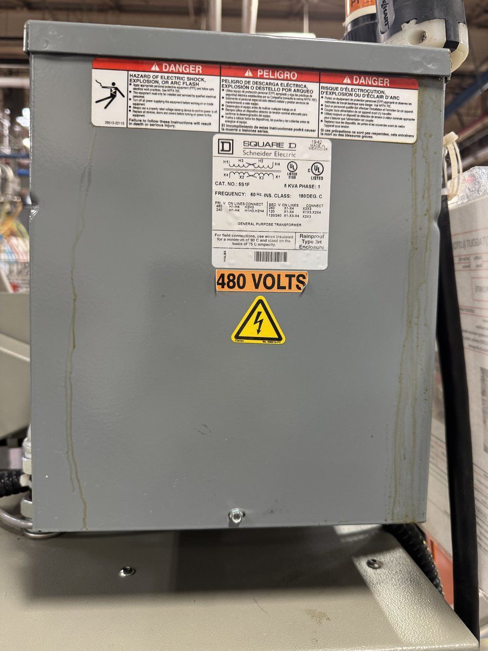 Transformer nameplate and enclosure with resin runs visible down both sides