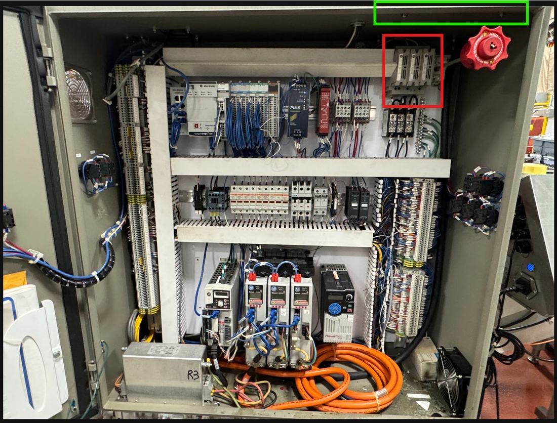 Line 7 machine control cabinet with the blown fuse location marked in red and the transformer position marked in green